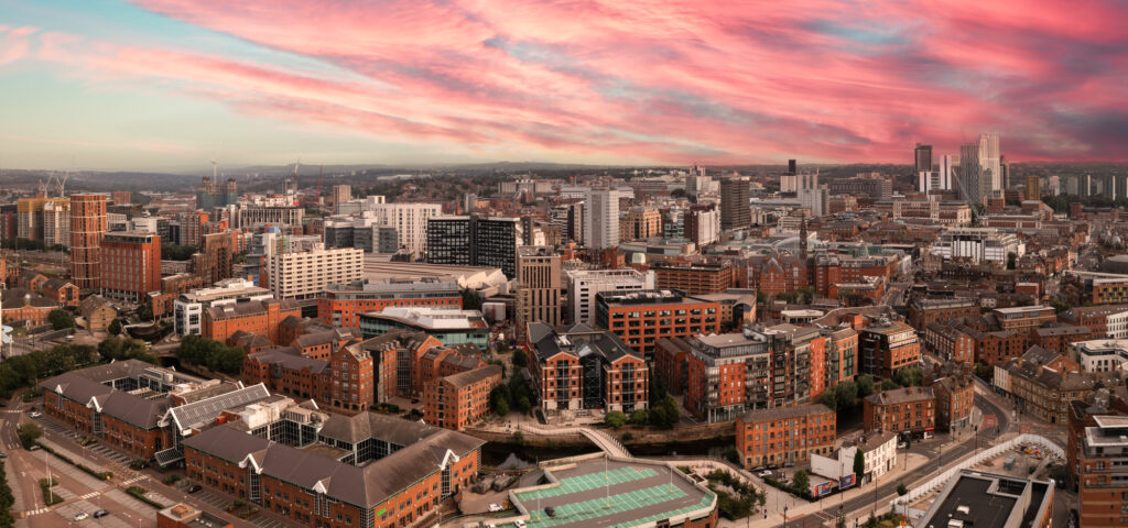 Aerial panorama of Leeds cityscape skyline at sunrise